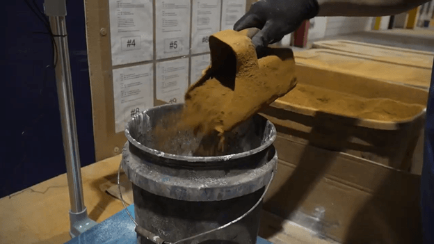 Cement is mixed prior to robotic spraying process.
