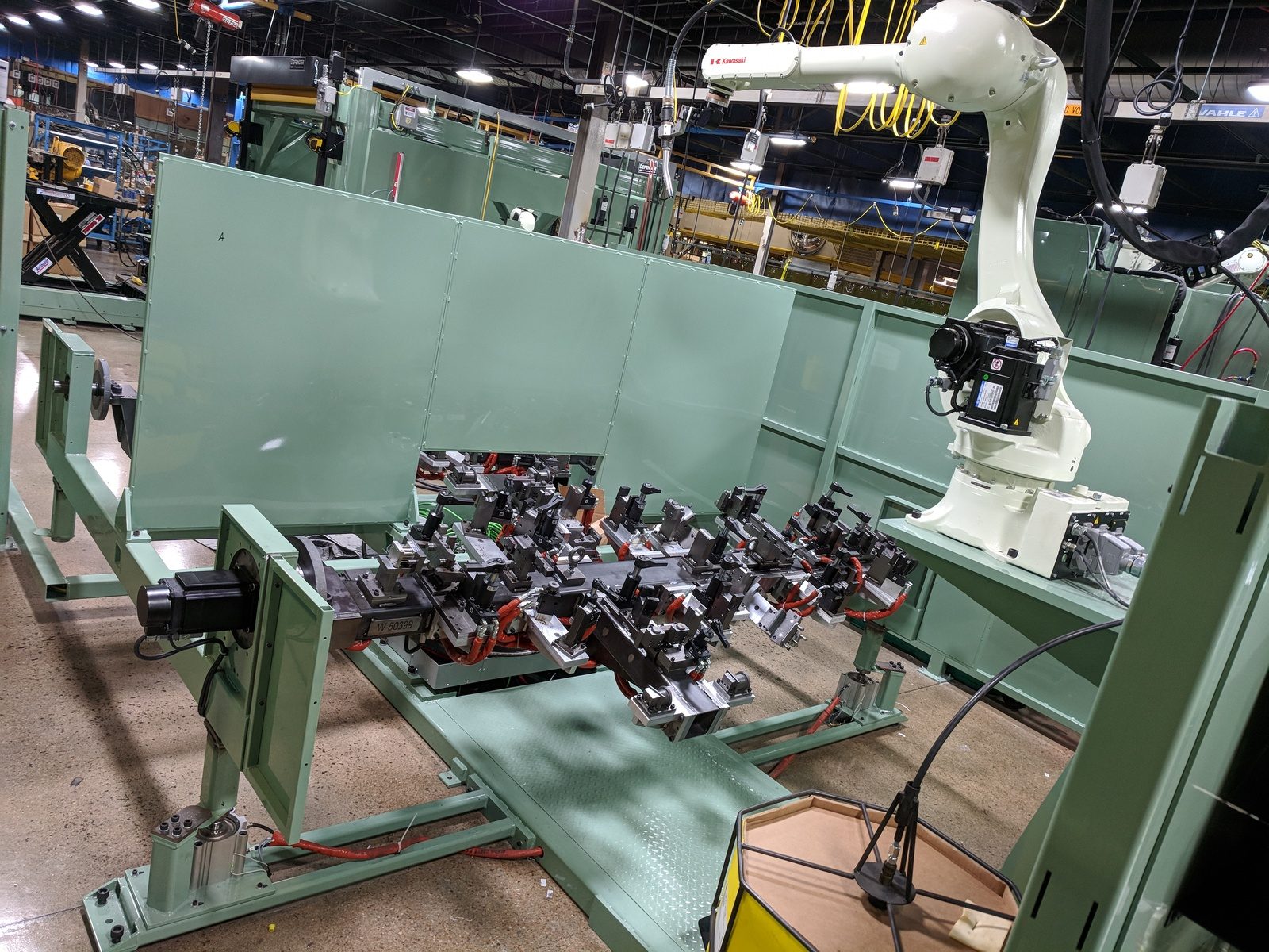 The inside of a Type 3 cell, which uses a Kawasaki RS010L robot to weld long parts.