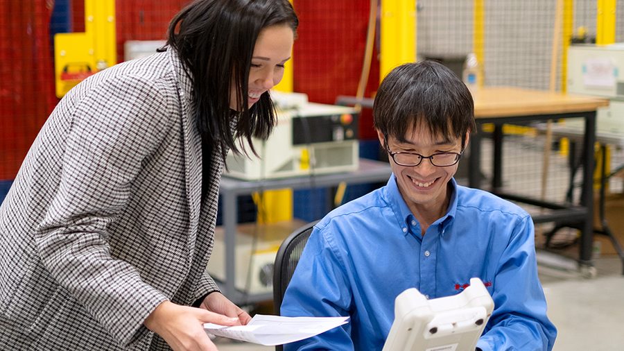 Kawasaki Robotics employees working together