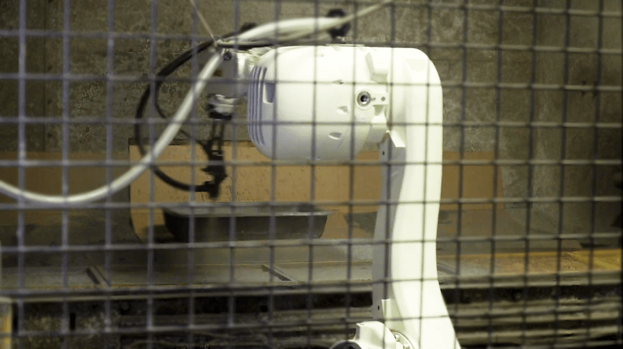 A Kawasaki general purpose robot is used in a robotic spraying process.