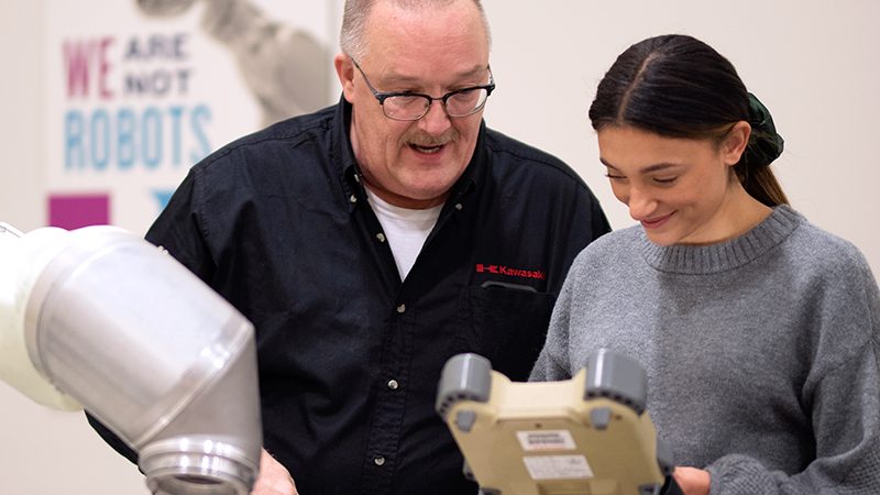 Kawasaki Customer Service team member helps train a student.